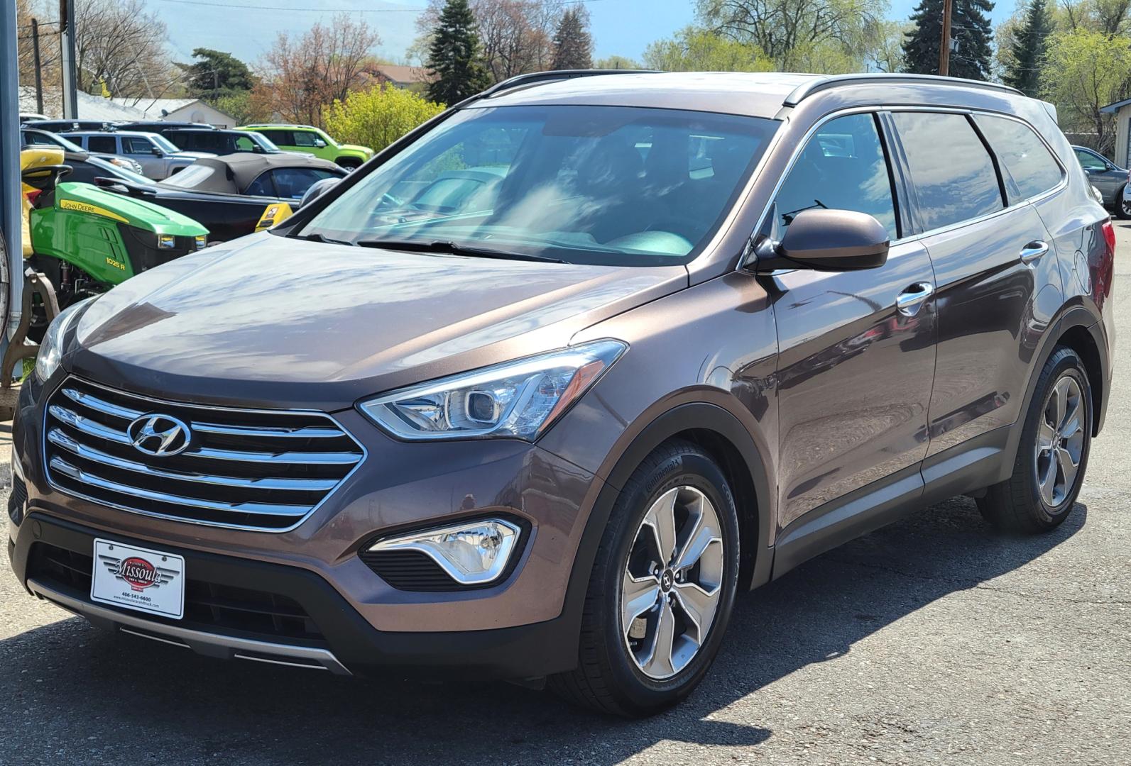 2015 Brown /Tan Hyundai Santa Fe GLS (KM8SMDHF7FU) with an 3.3L V6 engine, 6 Speed Auto transmission, located at 450 N Russell, Missoula, MT, 59801, (406) 543-6600, 46.874496, -114.017433 - Great Running AWD SUV. 3.3L V6 Engine. 6 Speed Automatic Transmission. 3rd Row Seating. Heated Front Seats. Power Drivers Seat. Backup Camera. AM FM XM CD. Bluetooth. Newer Continental Tires from Les Schwab. New Brakes. Air. Cruise. Tilt. Power Windows and Locks. - Photo#1